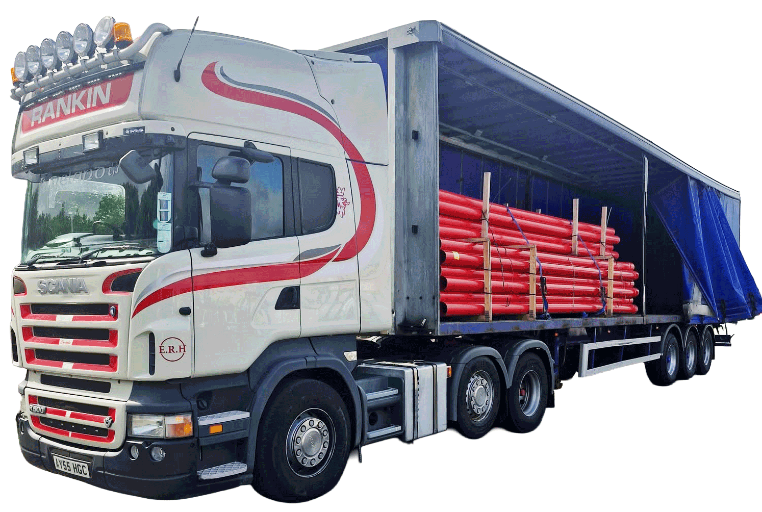 Red and white Rankin truck with blue truck curtain carrying red pipes